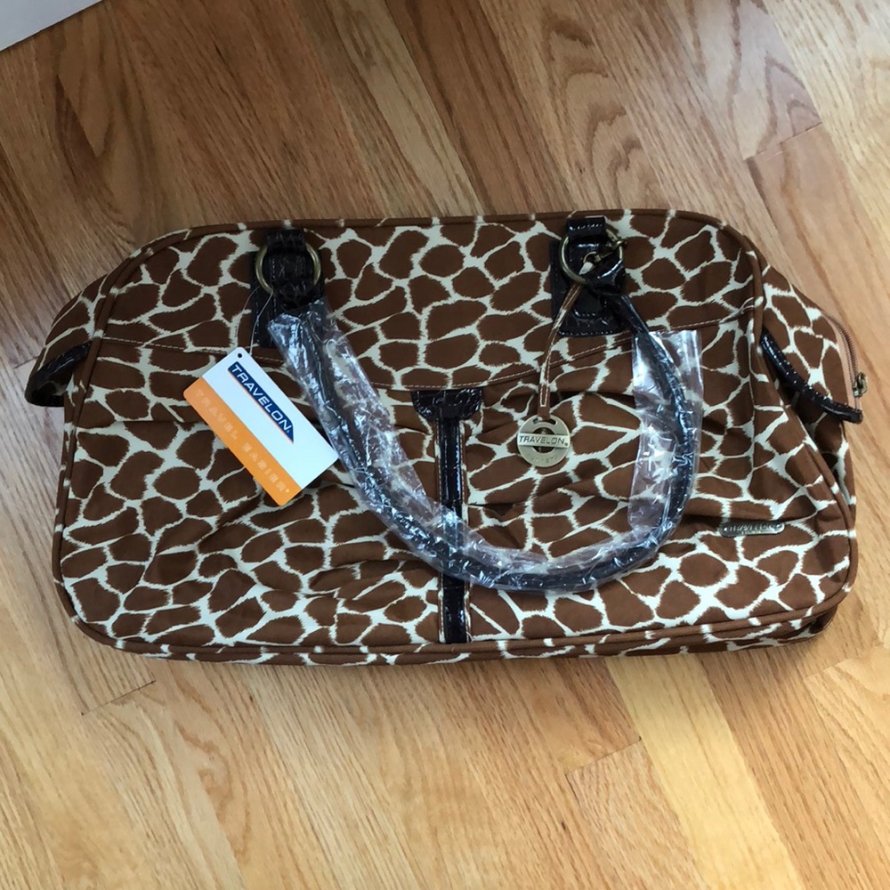 Travelon giraffe duffle. Easy to wipe clean!